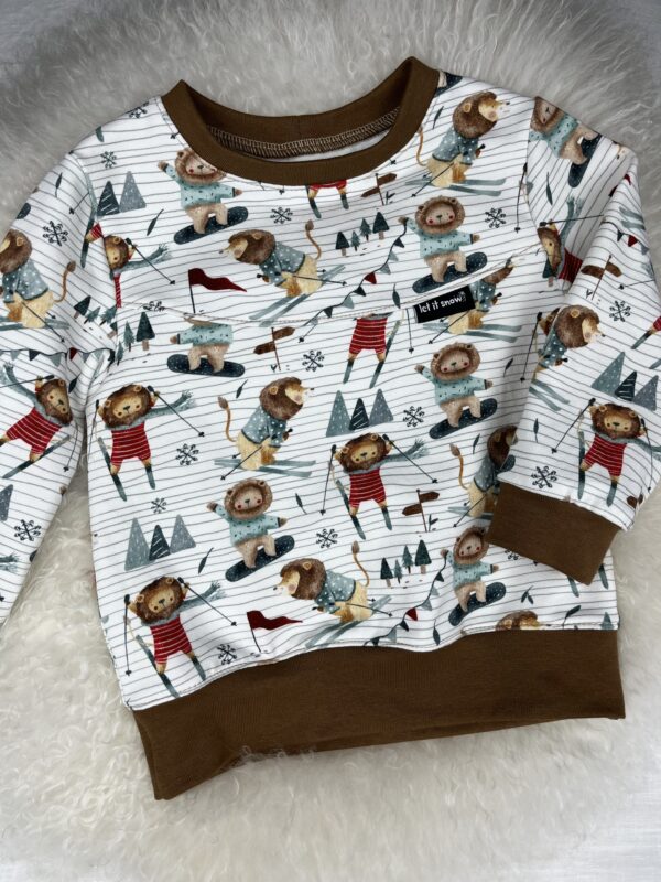 Pullover «Pullover mit Teilung - Skifahrer Löwe» Grösse 86